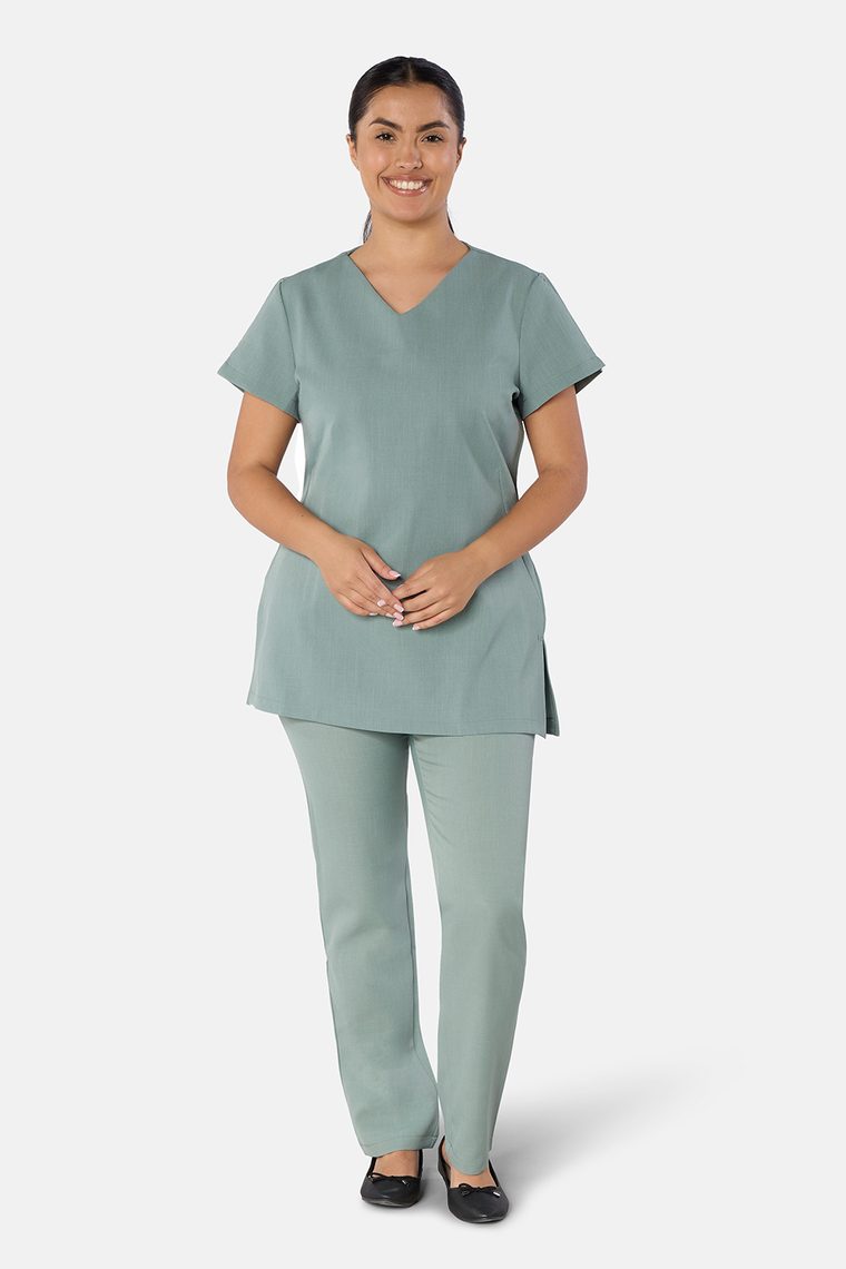 Woman wearing the Classic Front of House Tunic with matching trousers