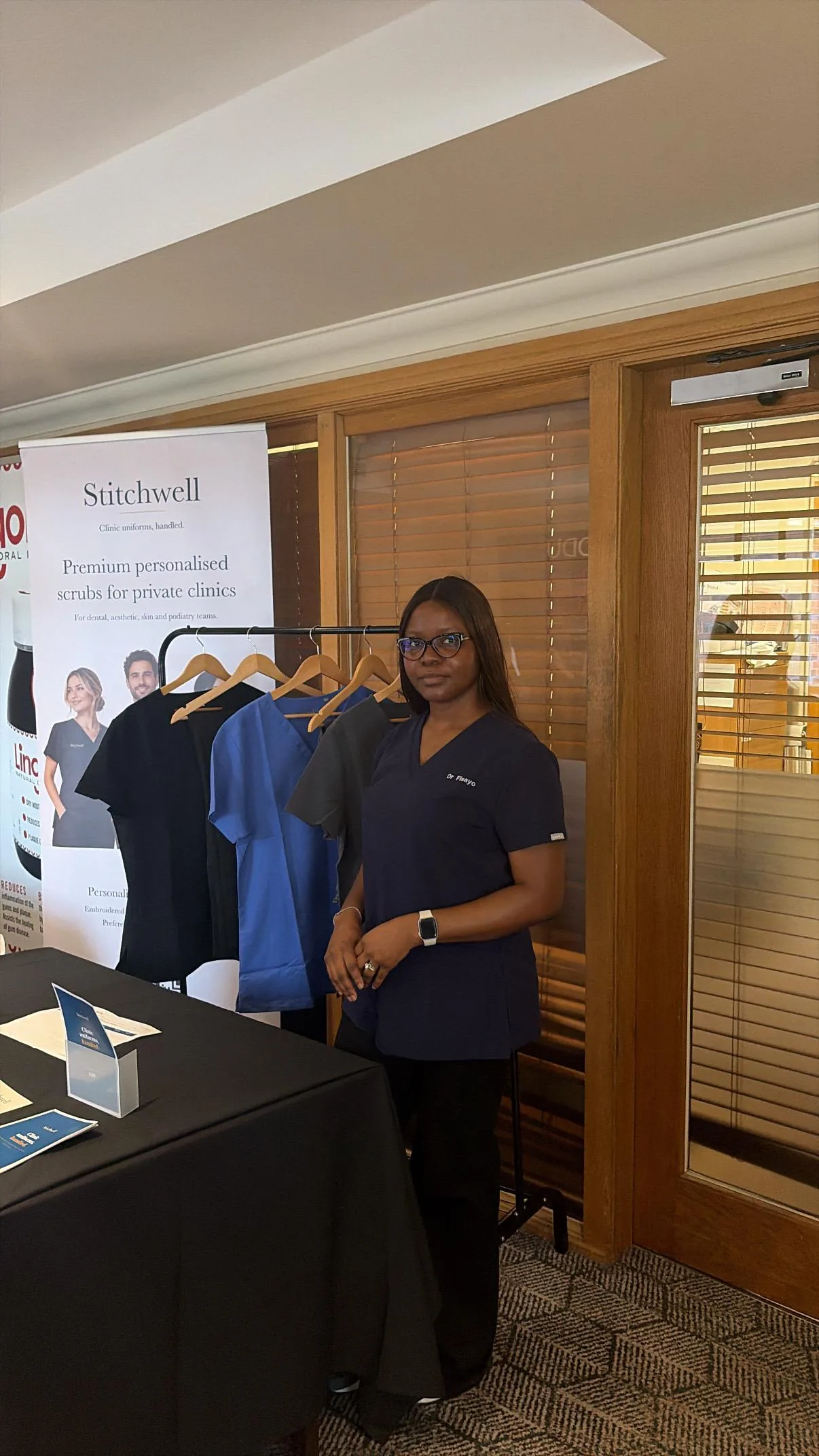 Stitchwell founder wearing personalised navy scrubs at the Force is Female North stand
